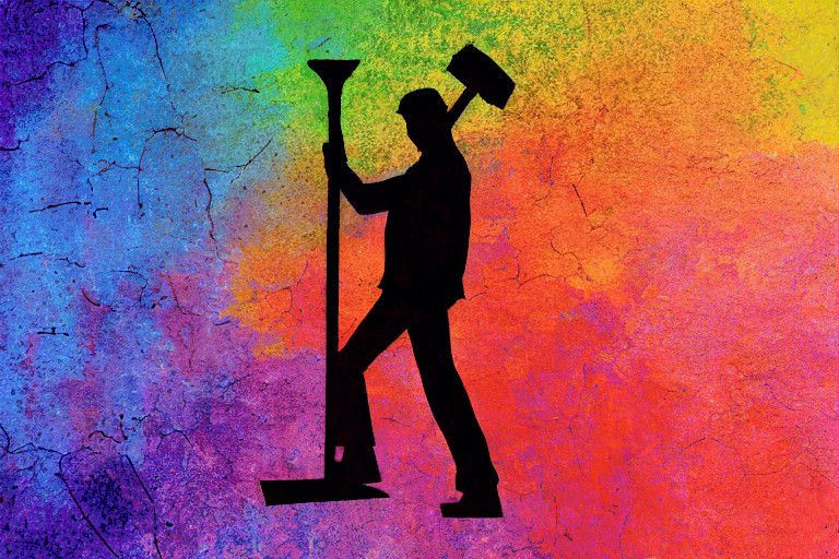 A cracked rainbow pigment background, with a silhouetted character hammering a human-sized nail into the ground